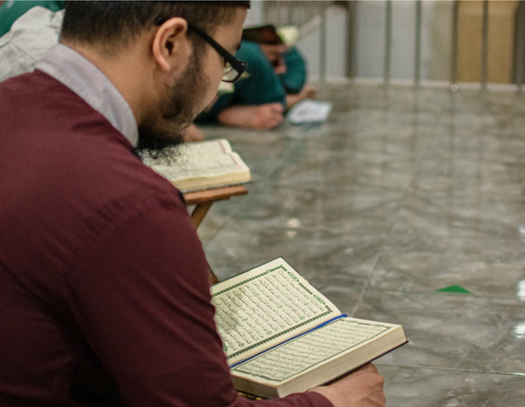Student reading the Quran